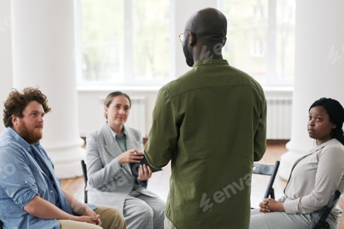 Preview: African American man sharing his trouble with patients at psychological session