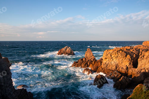 Preview: Beautiful view of blue ocean waves and brown cliffs on the coast of Sines, Portugal.