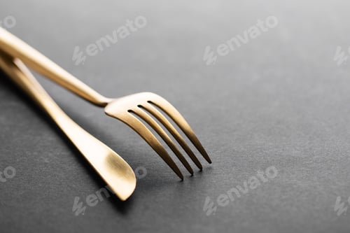 Preview: Gold cutlery set on black background