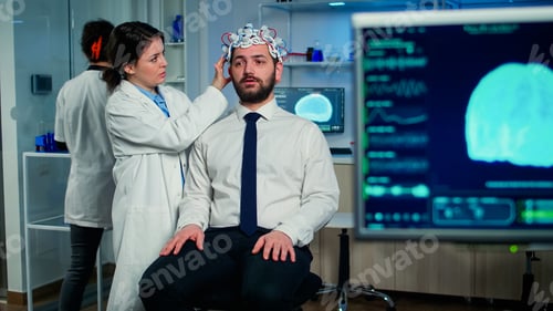 Preview: Medical researcher putting performant brainwave scanning headset