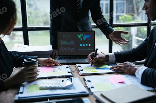 Preview: Teamwork with business people analysis cost graph on desk at meeting room.Business People Meeting De