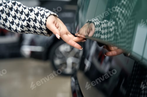 Preview: Customer opens the door of a modern car