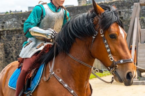 Preview: A medieval soldier on horseback at the castle of Fougeres. Brittany region, France