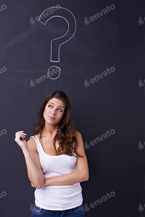 Preview: Thoughtful young woman standing beneath a chalk drawing of a question mark