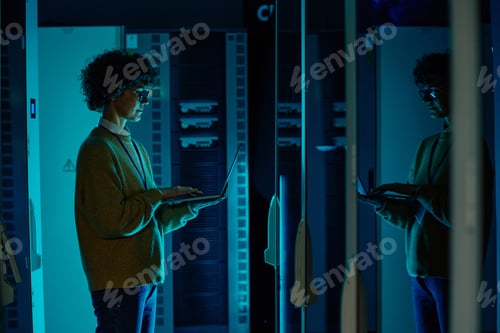 Preview: Engineer standing in data center