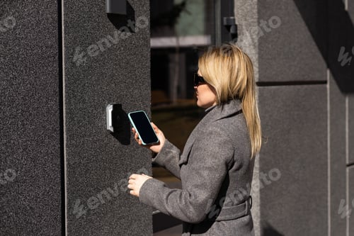 Preview: female entering secret key code for getting access and passing building using application on mobile