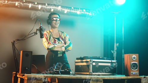 Preview: Woman disc jockey playing funky music on stereo turntables