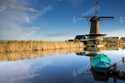 Preview: Dutch Windmill and Reeds Reflecting in Canal