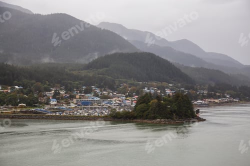 Preview: View of a small town, Juneau, during a cloudy morning with mountains in the background