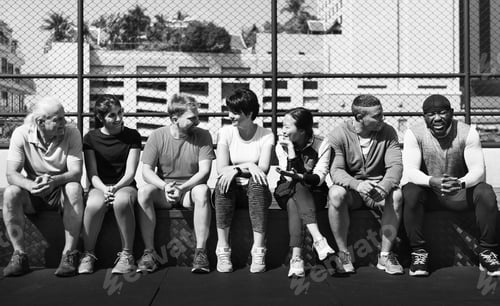 Preview: Group of diverse athletes sitting together