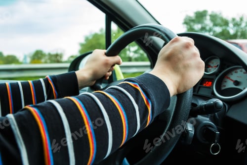 Preview: Male hands on steering wheel