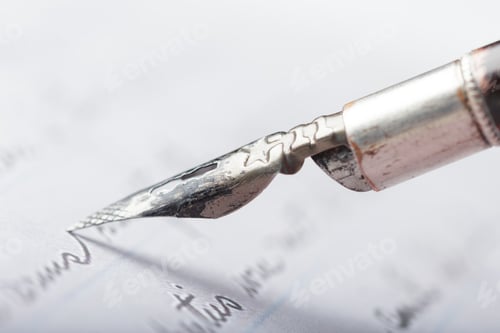 Preview: Close up of a fountain pen writing on paper showing ink and calligraphy