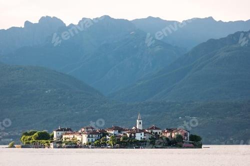 Preview: Island on high mountains background.