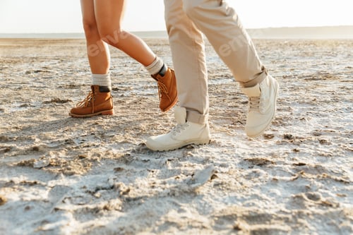 Preview: Couple outdoors at beach walking.