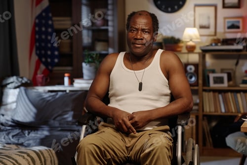 Preview: Portrait of Retired Black Man in Wheelchair Posing in His Bedroom