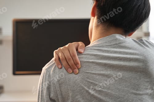 Preview: Japanese male businessman with shoulder pain from working from home