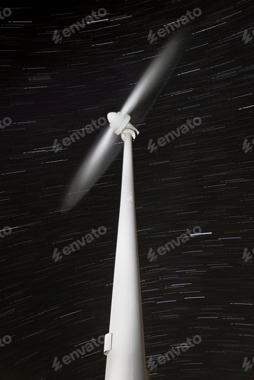 Preview: Wind wheel rotating with star trails in the background