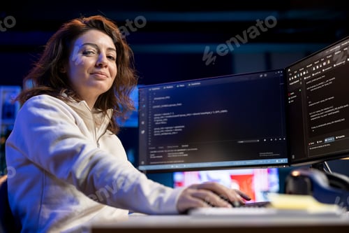 Preview: Portrait of smiling IT professional working from home developing software