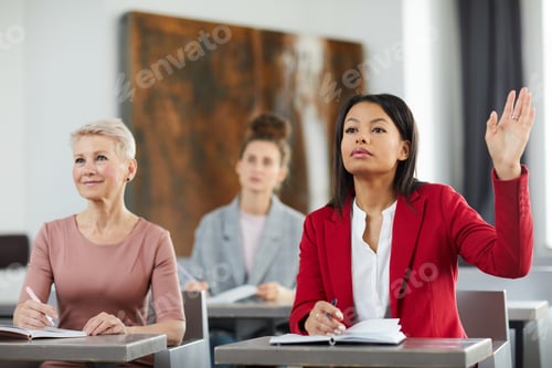 Preview: Businesswoman Raising Hand in Class