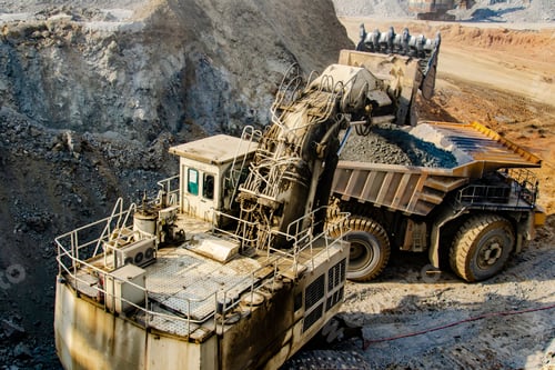 Preview: Excavator loading big dump truck in open pit