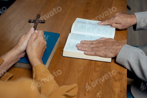 Preview: Men and women praying to God with the Bible.