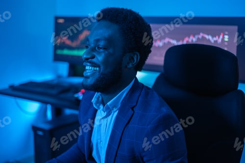 Preview: Profile photo of a young businessman at home making investments