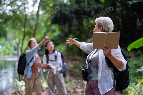 Preview: Backpack tourist travel outdoor adventure bird study using binoculars looking and record to book