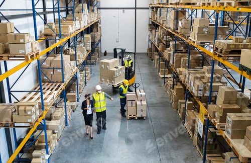 Preview: Top view of group of workers with manager working indoors in warehouse, coronavirus concept.
