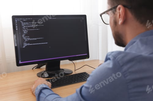 Preview: Programmer in Glsses Typing New Lines of HTML Code. Web Design Business and Web Development Concept