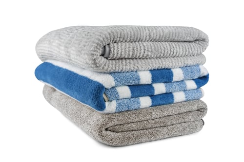 Preview: Soft Fluffy Striped Grey And Blue Bath Towels Folded In Stack Isolated On White Background