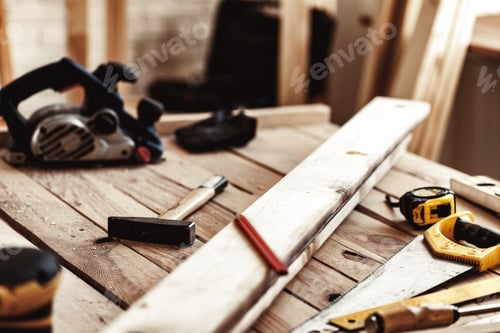 Preview: Hand saw on a wooden table in carpentry workshop