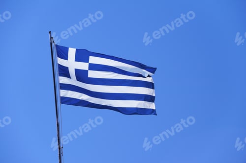 Preview: Greek flag waving on clean blue sky.