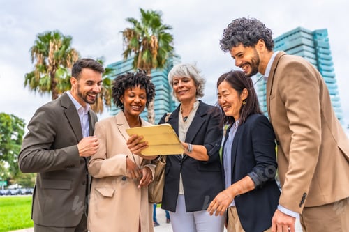 Preview: Multi-ethnic colleagues using digital tablet during outdoor business meeting