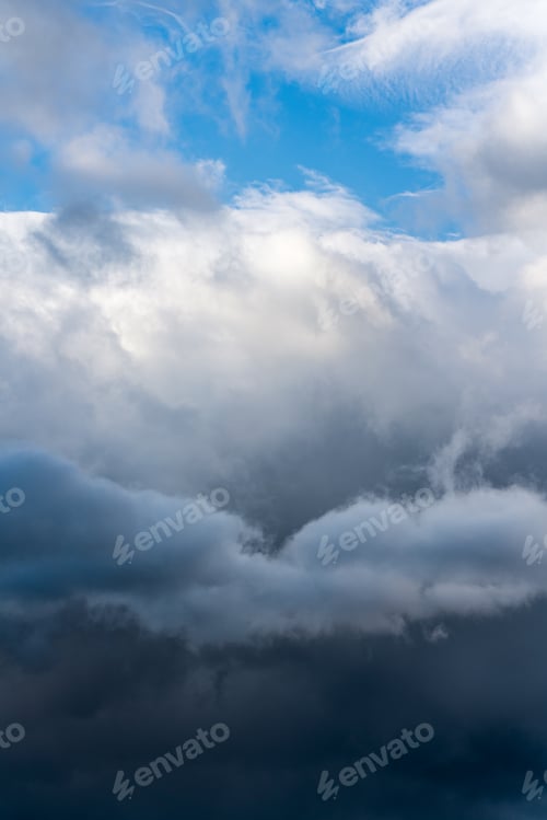 Preview: Scenery dramatic thunderstorm clouds with blue sky background