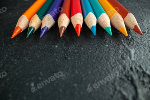 Preview: front close view colorful pencils lined on dark background drawing color photo art school