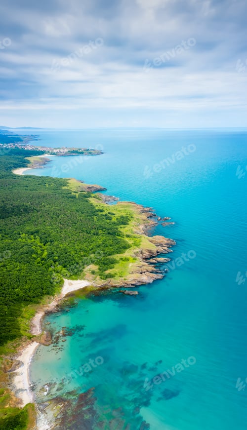 Preview: Picturesque rocky coastline with sandy beaches and green forests