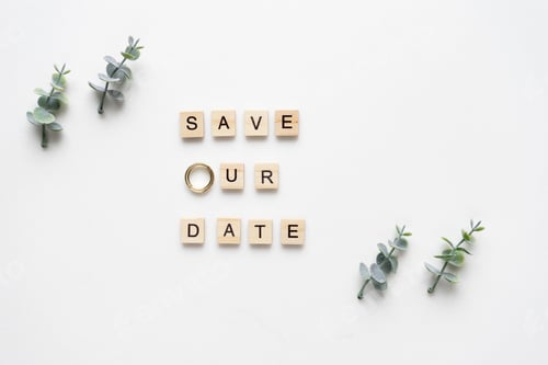 Preview: Wooden letters spelling save our date, oregano branches and wed
