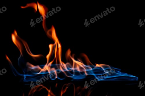 Preview: close up view of burning orange and blue flame on black background