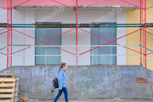 Preview: Repair and painting of the building. Scaffolding. Multicolored background. Construction garbage.