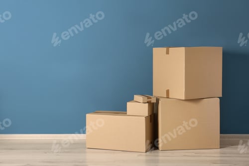 Preview: Cardboard boxes near color wall
