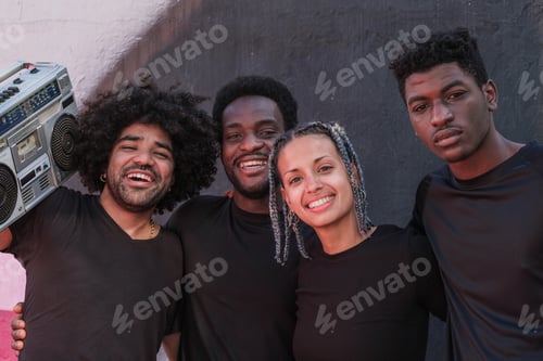 Preview: Group of friends with urban lifestyle listening to music on cassette