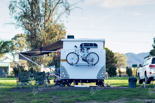 Preview: RV caravan with bike on the back camping at the caravan park