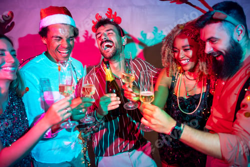 Preview: Friends drinking champagne at New Year's party midnight countdown