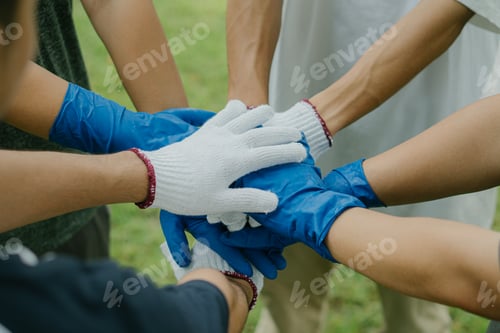 Preview: Hand stacking.Volunteer join hand together conceptEcology and World Environment Day.