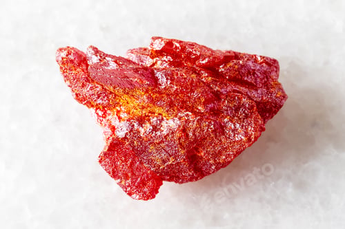 Preview: sample of rough realgar mineral on white marble