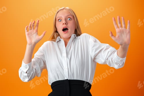 Preview: Photo of worried nervous teen girl afraid of something against orange background