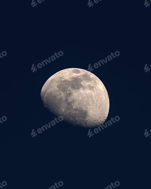 Preview: Vertical shot of waxing gibbous with dark sky in the background