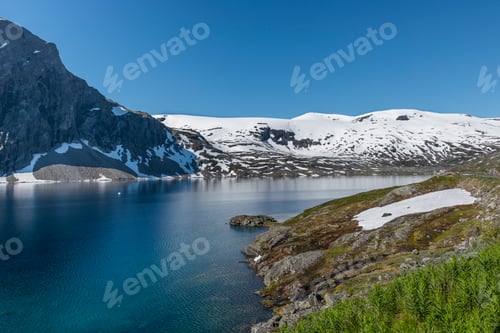 Preview: fjord with snow in summer in norway
