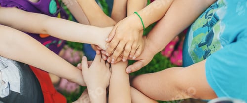 Preview: Children's hands together, street games. Selective focus.