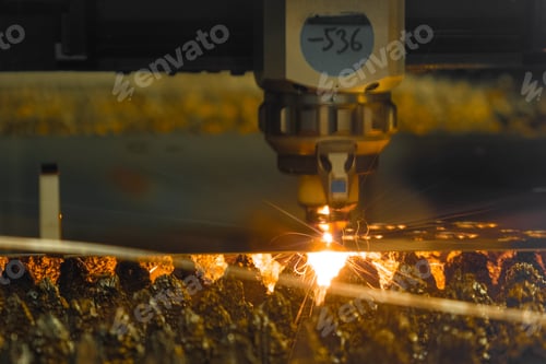 Preview: Laser cutter carves thin metal sheet with sparks in shop